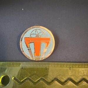 Disney Tomorrowland Orange and Silver Pin